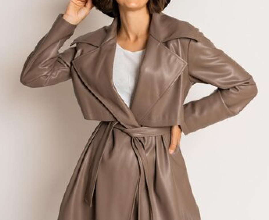 Model in a belted taupe leather trench coat
